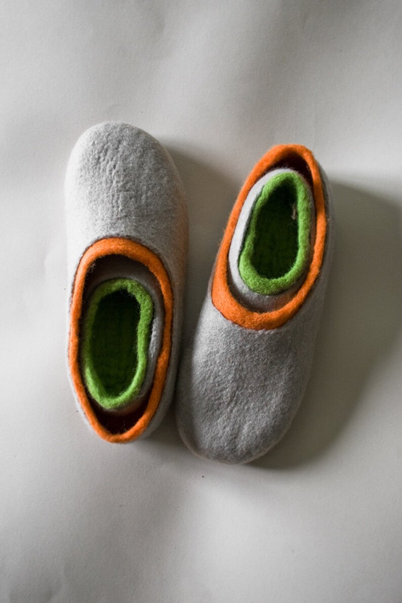2 pairs of matching BureBure felted wool slippers are designed for mom and daughter, dad and son. The inner part of these slippers is made of yellow semi soft wool while the outer part is decorated with natural beige alpaca wool.