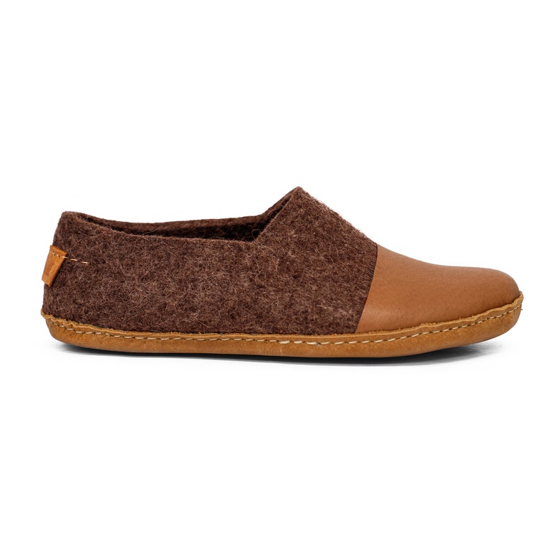 These BureBure handmade felted wool slippers for men are crafted entirely from natural wool. The natural felted wool offers a massaging effect on the skin and prevents sweating, keeping feet cool in warm and cozy in colder weather.