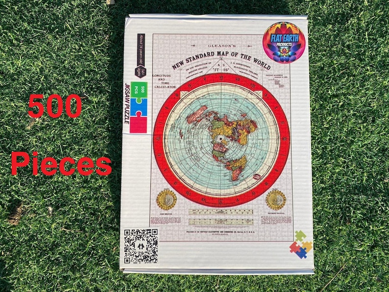 May include: A 500-piece jigsaw puzzle featuring a flat earth map with a red border. The puzzle box is white with a blue and green logo that says "Flat Earth Products".