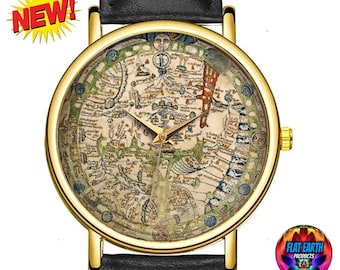 May include: A gold-tone wristwatch with a black leather strap features a vintage map of the world on the face. The map is surrounded by a circular border with text in a foreign language. The watch face also includes a set of hands and a small circular window at the 12 o'clock position.