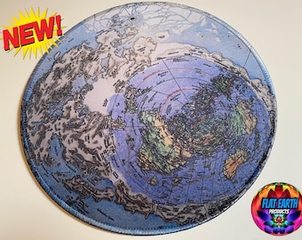 May include: Round mousepad featuring a map of the flat Earth, with a blue and gray color scheme. The map includes continents and a central Arctic region. The word "NEW!" is in a yellow burst. A logo for "Flat Earth Products" is in the corner.