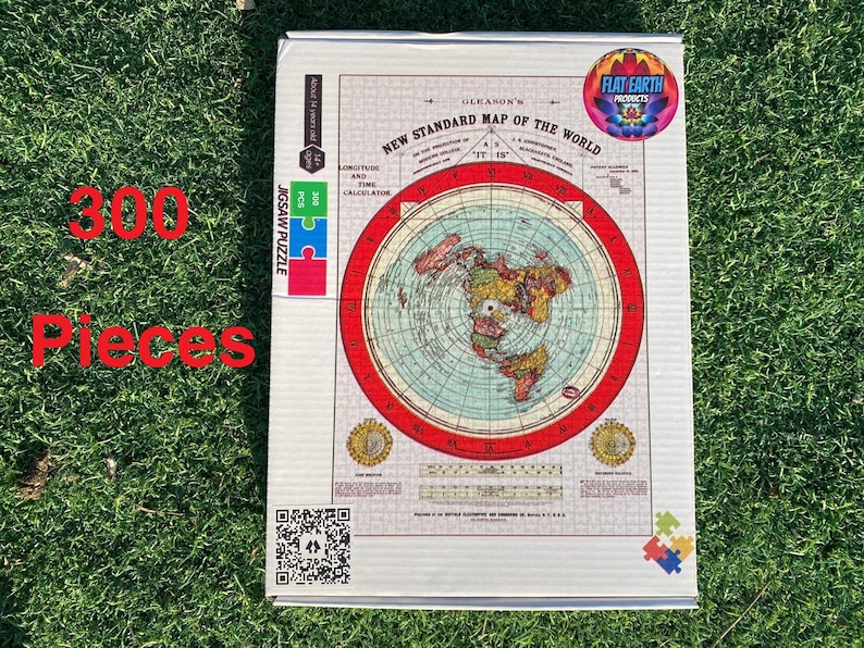 May include: A 300-piece jigsaw puzzle featuring a flat earth map with a red border. The puzzle box is white with a blue and green logo that says "Flat Earth Products".