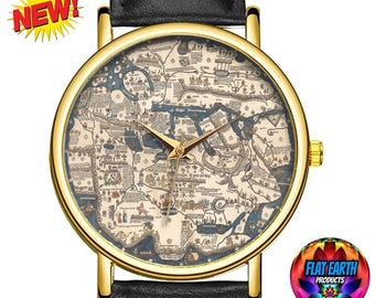 May include: Gold-coloured wristwatch with a black leather strap. The watch face displays a vintage map design in blue and beige. The watch has gold hands and a gold bezel. The word "NEW!" is in a yellow burst on the top left.