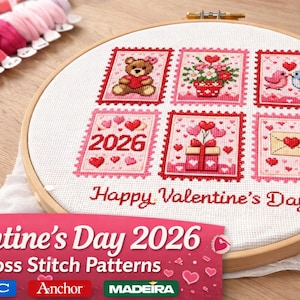 May include: A cross-stitch embroidery hoop featuring six Valentine's Day themed designs. The designs include a teddy bear, flowers, birds, the year 2026, a gift, and an envelope. The words "Happy Valentine's Day" are stitched below the designs.