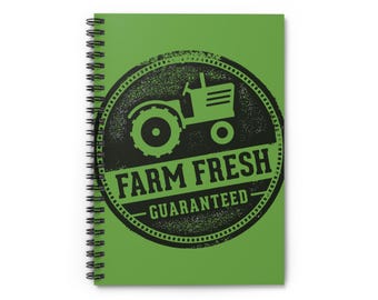 May include: Green spiral notebook with a black and white graphic of a tractor with the text "FARM FRESH - GUARANTEED".