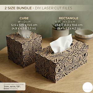 May include: Two laser-cut tissue box designs, cube and rectangle, with intricate leaf patterns. The cube measures 4.9 x 4.9 x 5.3 inches, and the rectangle is 9.4 x 5.1 x 4.2 inches. The text reads "2 SIZE BUNDLE - DIY LASER CUT FILES".