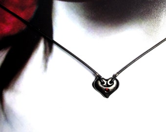 Mysterious Heart Necklace. Gothic Heart.  Choice of Seven. Hand-formed porcelain with vintage red foil glass cabochon.