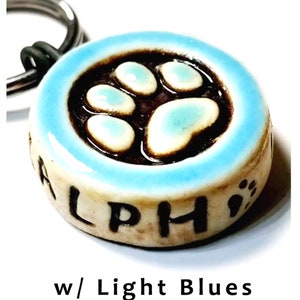 Paw Print Dog Tag. Custom. High-Fired Ceramic. Guaranteed Fur Life. Quiet, Lightweight, OOAK. Phone number carved into back image 1