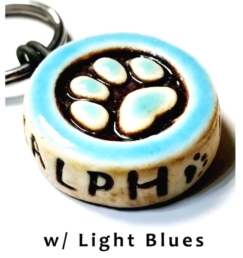 Paw Print Dog Tag. Custom. High-Fired Ceramic. Guaranteed Fur Life. Quiet, Lightweight, OOAK. Phone number carved into back image 1