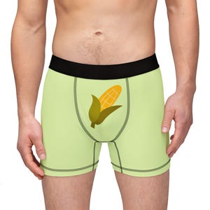 May include: Light green boxer briefs with a yellow corn cob graphic.