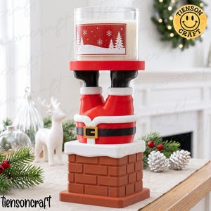 May include: A candle holder shaped like Santa Claus legs sticking out of a brick chimney. The base is a brown brick chimney with white snow on top. Santa wears red pants, black boots, and a black belt with a gold buckle. A candle sits on the platform.
