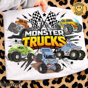 May include: White fabric with a vibrant graphic of monster trucks. The design showcases five cartoon monster trucks in different colours, the words "MONSTER TRUCKS" in yellow and black, and chequered flags.