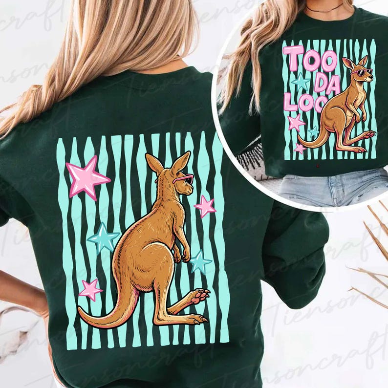 May include: Dark green sweatshirt with a kangaroo wearing sunglasses, set against a backdrop of blue and white stripes and pink and blue stars. The text "TOO DA LOO" is also visible.