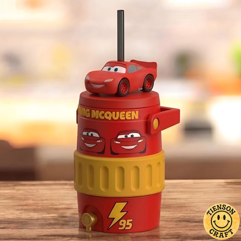May include: A red and yellow plastic water jug featuring a Lightning McQueen car topper, a black straw, and the text LIGHTNING MCQUEEN. The jug displays two car face graphics, a yellow textured middle band, and a yellow lightning bolt with the number 95.