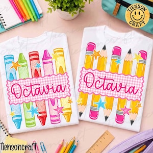 May include: Two white t-shirts featuring school supply graphics. The left shirt displays colorful crayons and the name Octavia in pink script. The right shirt shows yellow pencils and the name Octavia in pink script on a pink gingham banner.