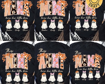 May include: Black t-shirts with a Halloween-themed design. The shirts say "This Mama" with orange and pink accents, and "lover her little boos" below. Ghost graphics and names are also featured.