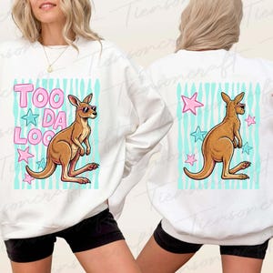 May include: White sweatshirt with a cartoon kangaroo wearing sunglasses. The front design features the text "TOO DA LOO" in pink letters with blue stars. The back has a similar design with a kangaroo and stars.