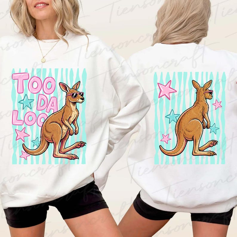 May include: White sweatshirt with a cartoon kangaroo wearing sunglasses. The front design features the text "TOO DA LOO" in pink letters with blue stars. The back has a similar design with a kangaroo and stars.