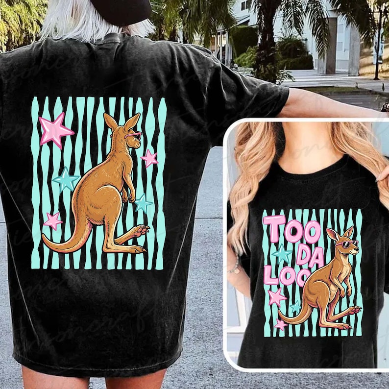 May include: Black t-shirt with a kangaroo wearing sunglasses, set against a teal and black striped background with pink and blue stars. The text "TOO DA LOO" is also visible.