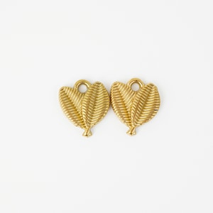 May include: Two gold-colored leaf charms with a textured, ribbed design. Each charm has a loop at the top for attaching to jewelry. The leaves are detailed with veins and a small stem at the base. The charms are set against a white background.