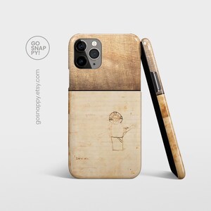 May include: A phone case with a wood-grain design on the top half and a vintage drawing of a person with a halo on the bottom half. The drawing is on a parchment-like background.