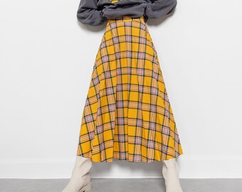 Yellow plaid skirt and blazer insurance shop