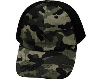 May include: A black and green camouflage baseball cap with a mesh back.