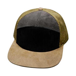 May include: A brown, black, and green corduroy and mesh baseball cap with a brown suede brim.