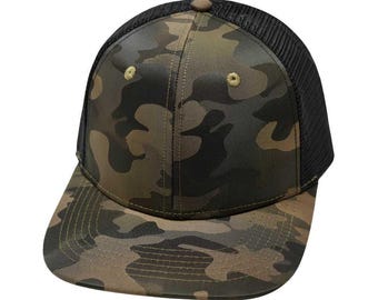 May include: A camouflage trucker hat with a black mesh back. The hat has a flat brim and a structured crown.