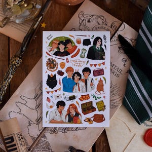 May include: A sticker sheet featuring illustrations of characters and objects from a fantasy book series. The sheet includes images of characters, a black cat, a suitcase, and other themed elements. The background includes a wand, candles, and parchment.