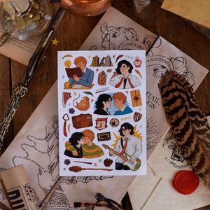May include: A sticker sheet featuring illustrations of characters, objects, and scenes. The sheet is on a wooden surface with parchment, a wand, a candle, and a copper pot. The illustrations include a couple kissing, a character playing guitar, and a character reading.