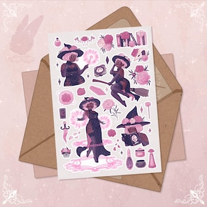May include: A sheet of stickers featuring illustrations of witches in black dresses and hats, surrounded by pink flowers and magical items. The stickers are on a white background, with a brown envelope in the background.