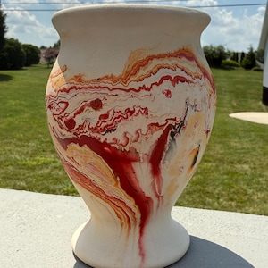 Nemadji Indian River Pottery Vase - Bisque Exterior, Glazed interior - Red, Orange, Black swirls. Stamped Indian Head on Bottom.