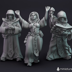 Può includere: Tre figure in miniatura dipinte di grigio che rappresentano persone con tuniche con cappuccio e che tengono vari oggetti. Le figure sono in piedi su uno sfondo grigio.