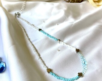 Beaded necklace. On a special day or daily uses. White and sky blue color. Elegant and unique.