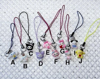 Mini Sanrio character charm straps for cell phones, ear buds cases, keys and purses.