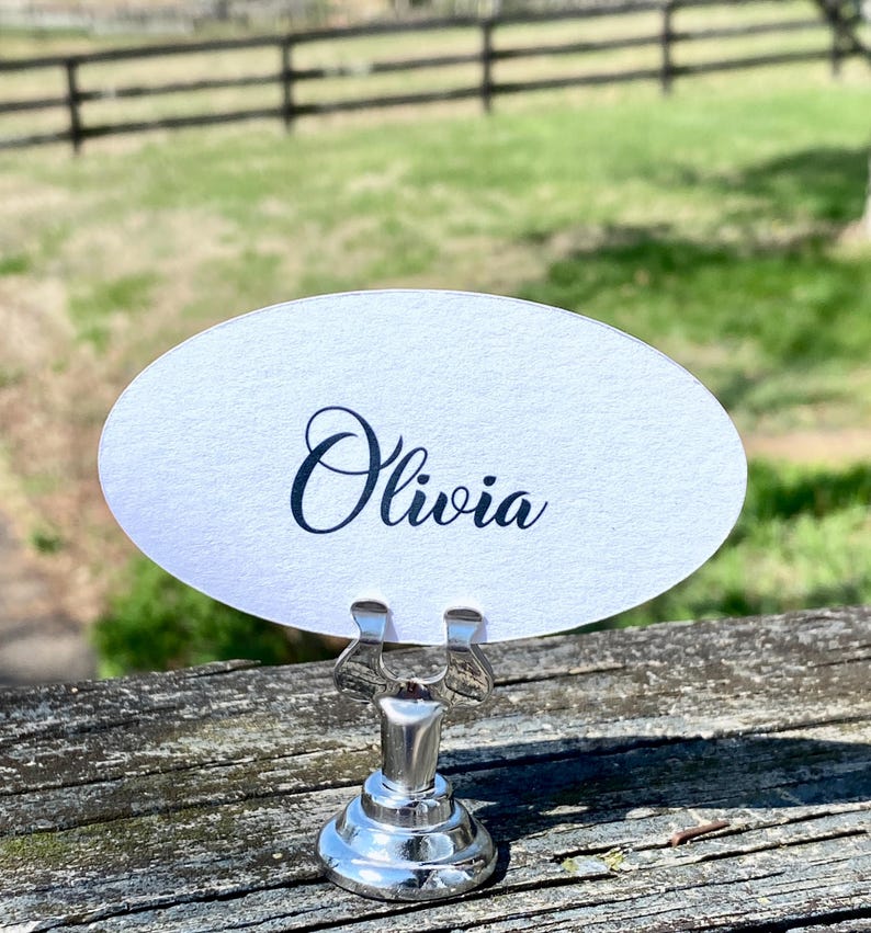 May include: A set of three ceramic mugs with a speckled, matte finish. The mugs are in shades of cream, light gray, and dark gray. Each mug has a simple, minimalist design, perfect for coffee or tea.