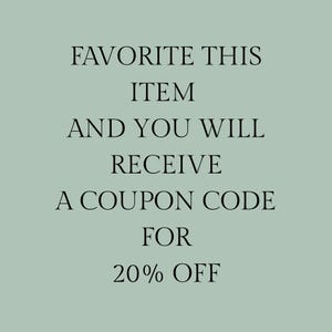 May include: A set of three ceramic mugs with a speckled, matte finish. The mugs are in shades of cream, light gray, and dark gray. Each mug has a simple, minimalist design, perfect for coffee or tea.