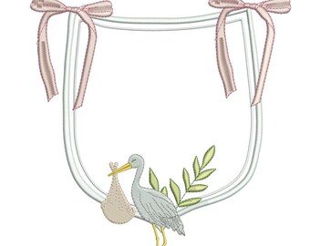 May include: A white frame with pink ribbon bows at the top, a gray stork carrying a small white bag, and a green leafy branch.