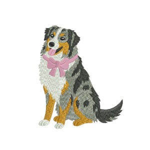 May include: An embroidered image of a dog with a pink bow tie. The dog has a multi-colored coat of black, gray, white, and tan. The dog is sitting with its tongue sticking out. The background is white.