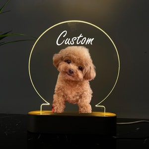 May include: A custom LED night light with a wooden base and a clear acrylic circle featuring a small brown dog with the word "Custom" written on the circle.