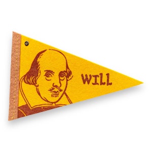 May include: Yellow felt pennant with a brown illustration of William Shakespeare and the word "WILL". The pennant has a brown border and two metal grommets at the top. A decorative item.