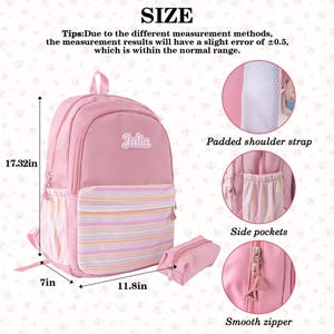 May include: Pink backpack with the name "Julia" on it, featuring a striped front pocket and side pockets. The backpack measures 17.32 inches high, 7 inches deep, and 11.8 inches wide. Includes a matching pencil case and a smooth zipper.