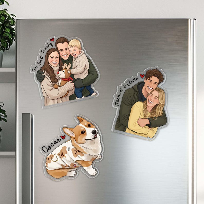 May include: Refrigerator magnets featuring custom illustrations. One magnet shows a family with the text "The Smith Family". Another magnet depicts a couple with the text "Michael & Olivia". A third magnet shows a corgi dog with the text "Oscar".