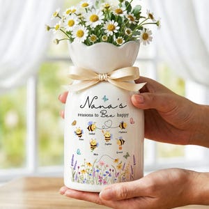 May include: A set of three ceramic mugs with a speckled, matte finish. The mugs are in shades of cream, light gray, and dark gray. Each mug has a simple, minimalist design, perfect for coffee or tea.