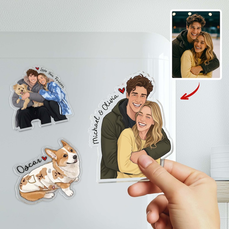 May include: A collection of personalized magnets featuring cartoon illustrations of couples and a dog. One magnet shows a couple with the text "Michael & Olivia" and a heart. Another magnet has the text "Love You Forever". A third magnet shows a dog with the name "Oscar".