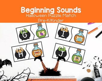 May include: A set of four rectangular Halloween-themed puzzle cards featuring letters G, H, I, and J. Each card shows a black cauldron with a letter and a matching potion bottle with an illustration representing the beginning sound of that letter.