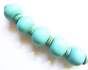 TURQUOISE    5 turquoise hollows and 12 silvered turquoise mini discs, matte finish    A Beaded Gift