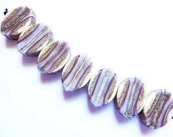 SILVERED AMETHYST LAYERS    7 ivory, silver, amethyst and silvered ivory zulus    A Beaded Gift