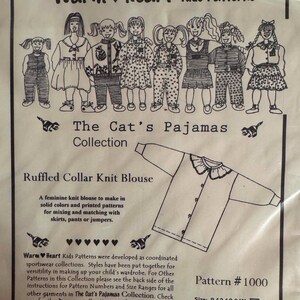 May include: A sewing pattern envelope for Warm Heart Kids Patterns titled The Cat's Pajamas Collection, Pattern #1000. It features illustrations of children in various outfits and a line drawing of a ruffled collar knit blouse with buttons.